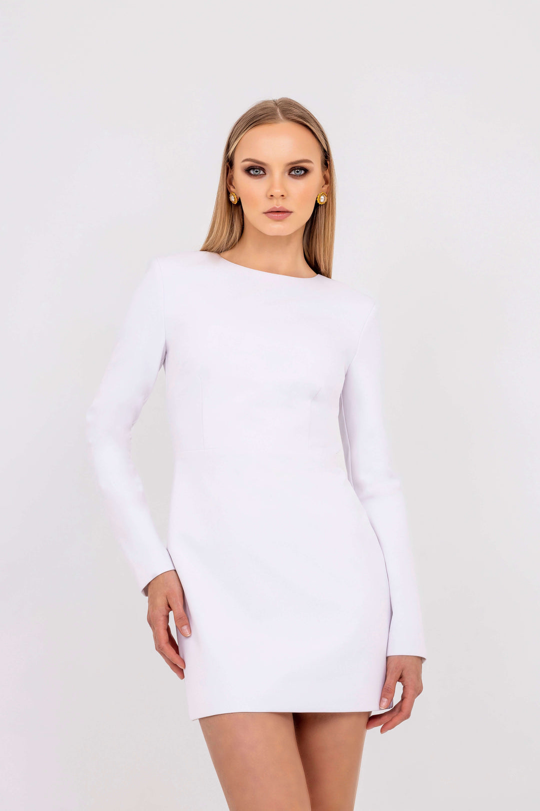 Michèle White Mini Dress From 
Leochèle Campaign Collection- long sleeve fitted white dress on model
