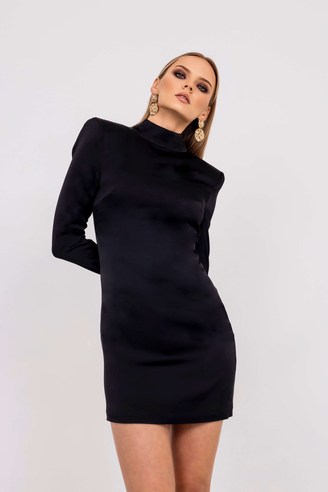 Valentina Black Satin Mini Dress from Leochèle campaign collection- model in long sleeves black satin dress