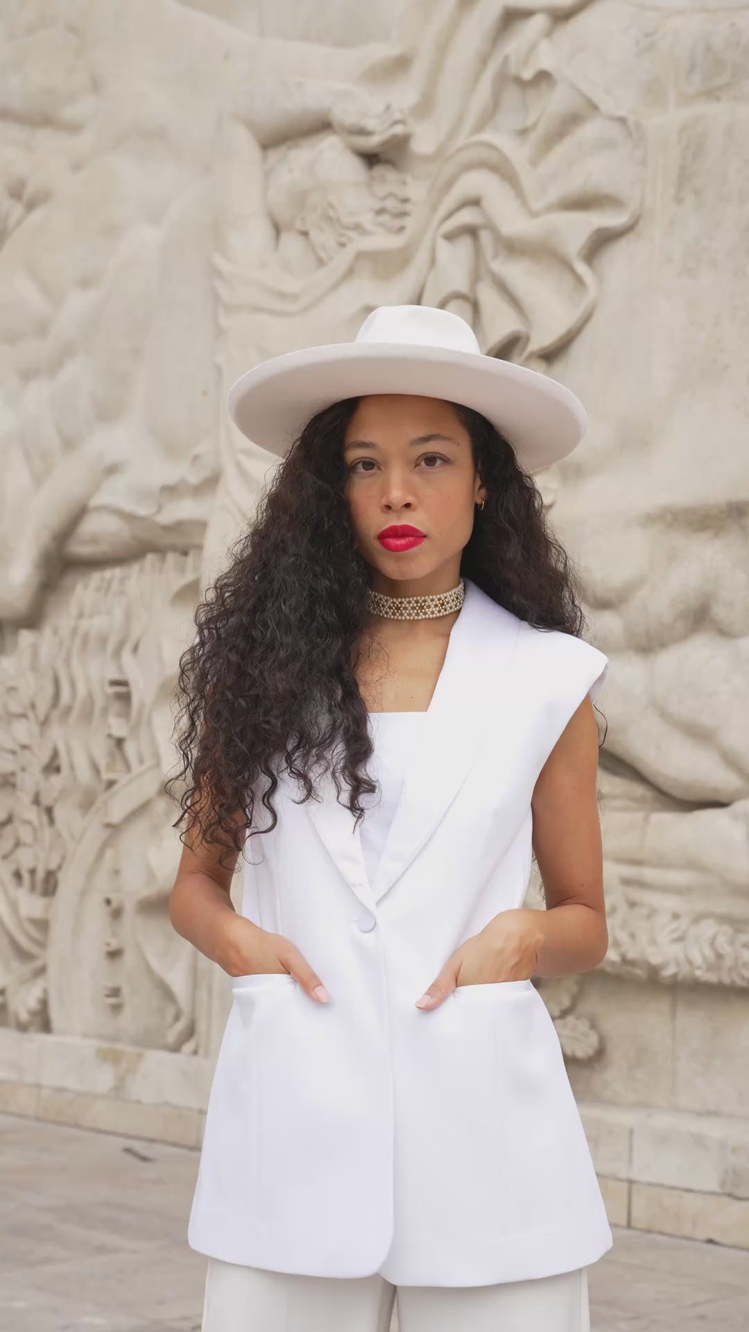 Close-up view of a model wearing the Roza sleeveless blazer by Leochèle.